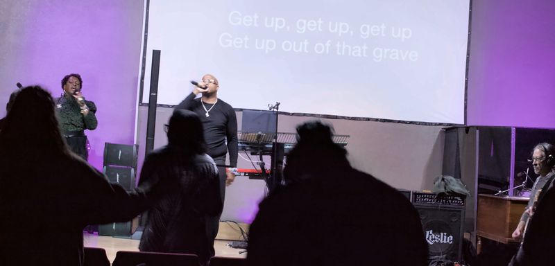 Congregation worshipping during service